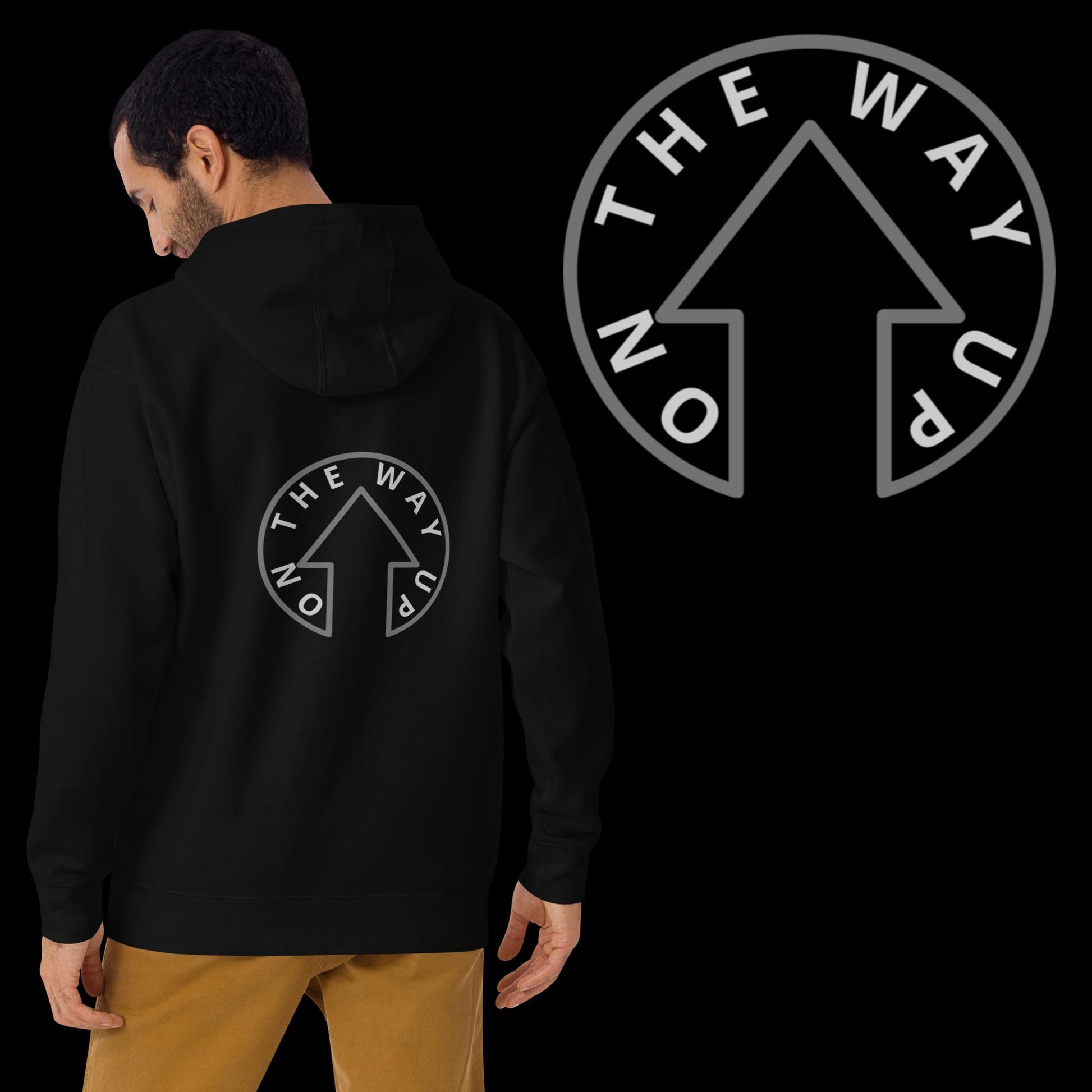 A man in a Signature Hoodie from On The Way Up Apparel, with the phrase "On The Way Up" and an upward arrow design on the back, paired with tan pants, viewed from the rear and side angle.