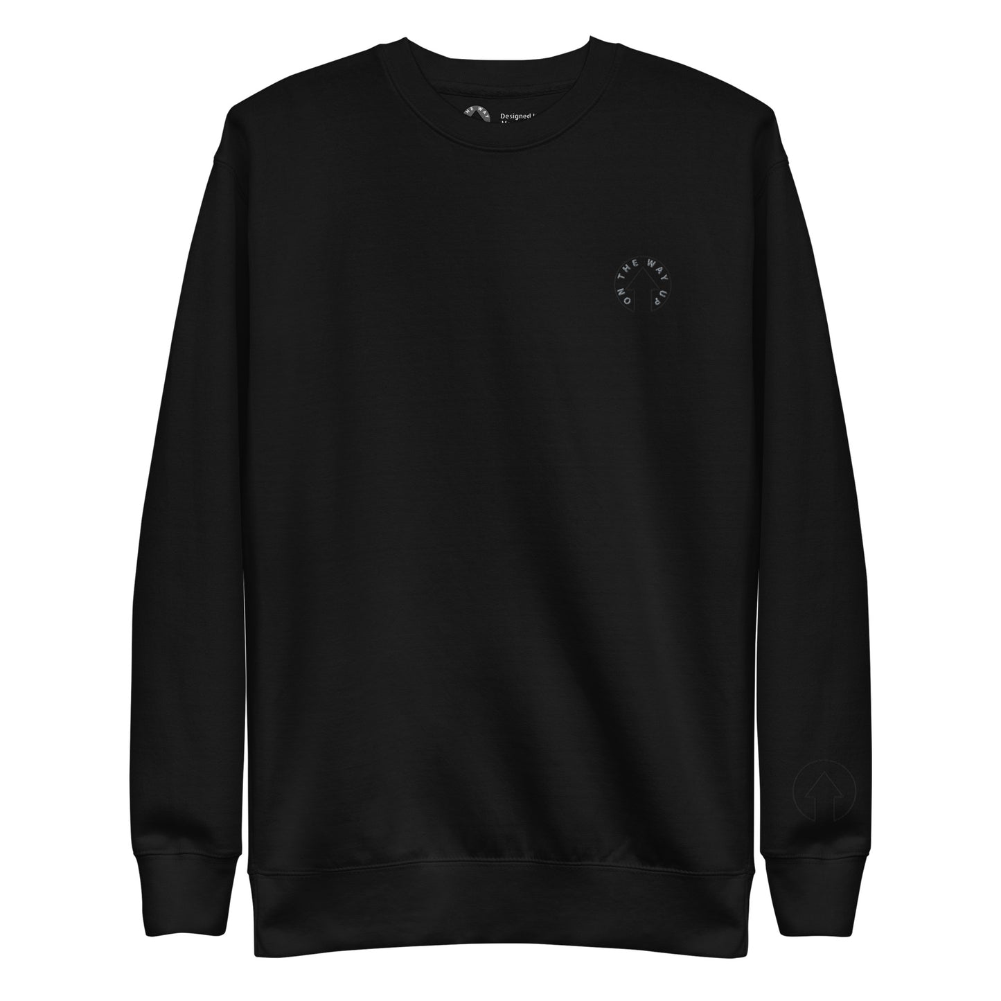 Black crewneck Signature Embroidered Logo sweatshirt with a small white logo embroidered on the left chest, displayed on a plain background. The "Manchester" sweatshirt features long sleeves and ribbed cuffs, showcasing premium quality by On The Way Up Apparel.