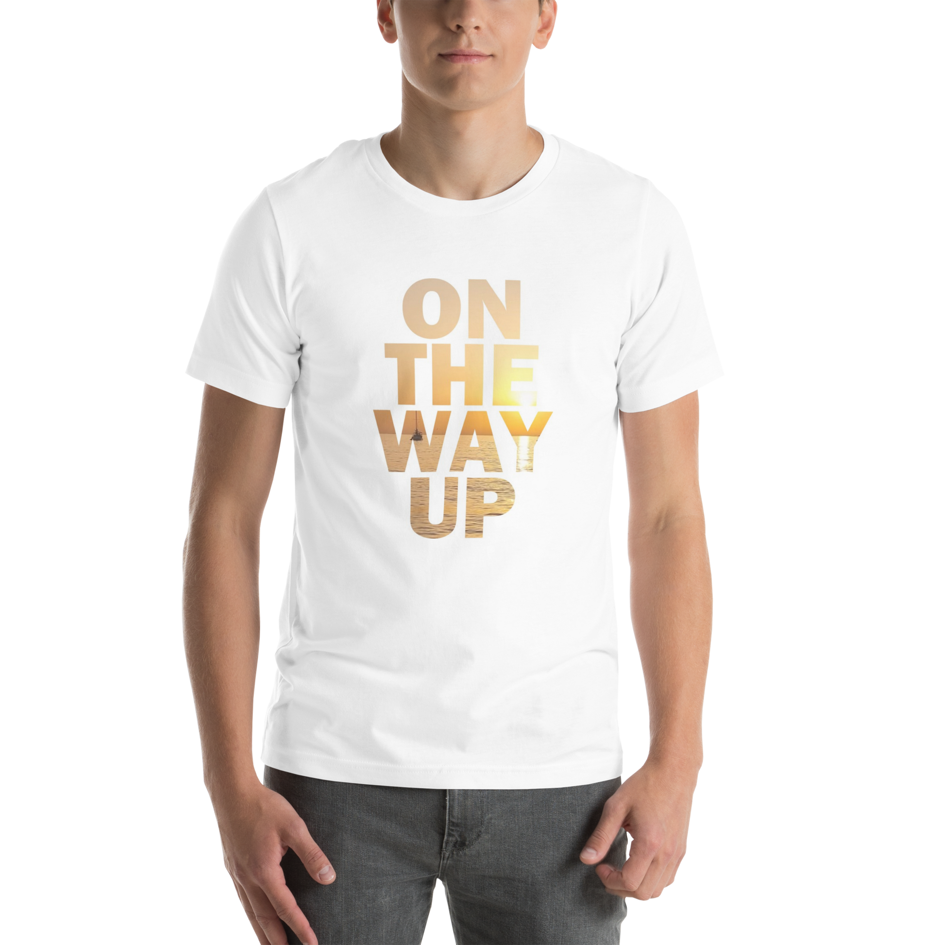 A person wearing the Mambo Beach Sunset Tee by On The Way Up Apparel, a white, lightweight cotton t-shirt featuring the phrase "ON THE WAY UP" in gold, metallic lettering. The individual has short hair and is standing against a black background. The bottom half of their face is not visible. This made-on-demand t-shirt offers ultimate comfort and style for everyday wear.